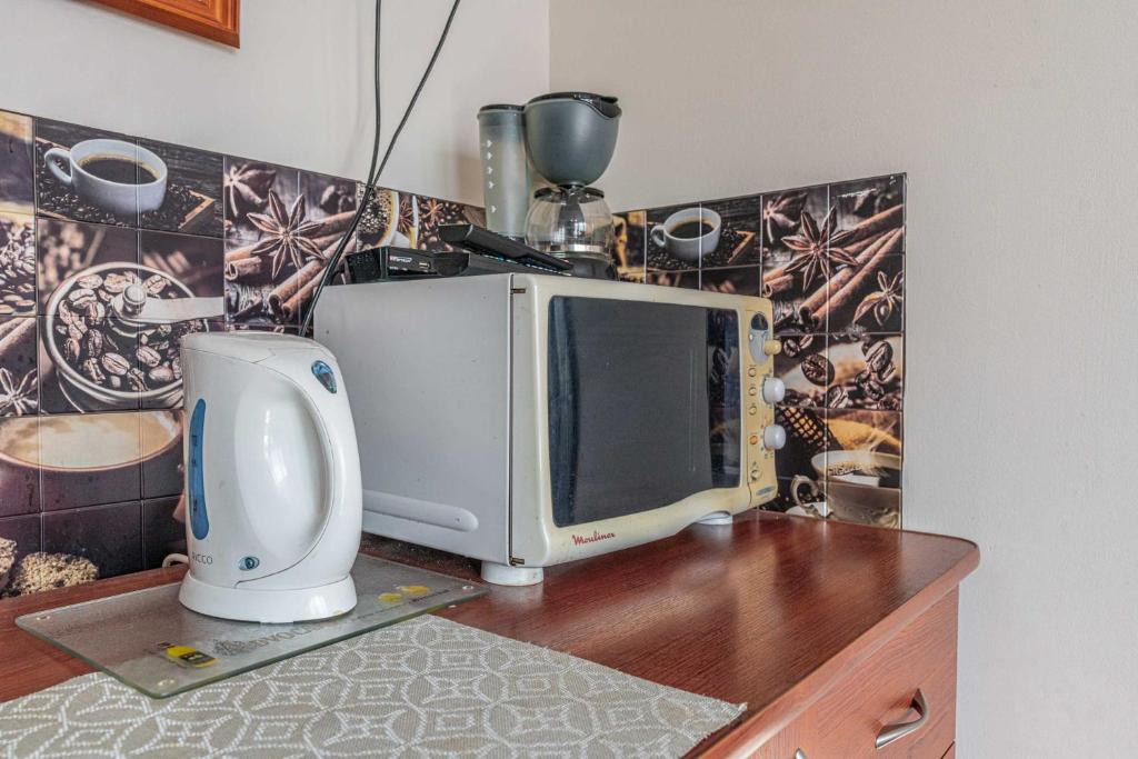 Kuchyňa alebo kuchynka v ubytovaní Apartamenty Kluśka
