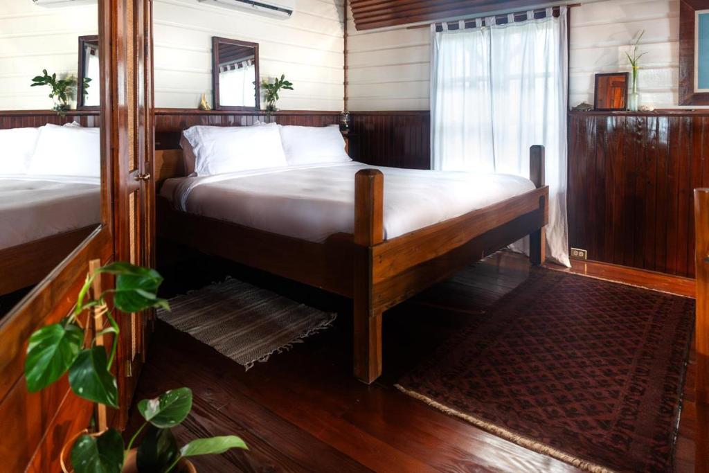 Katil atau katil-katil dalam bilik di Casa Acuario Boutique Hotel