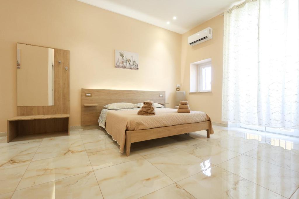 Un pat sau paturi într-o cameră la Room - Vista Mare