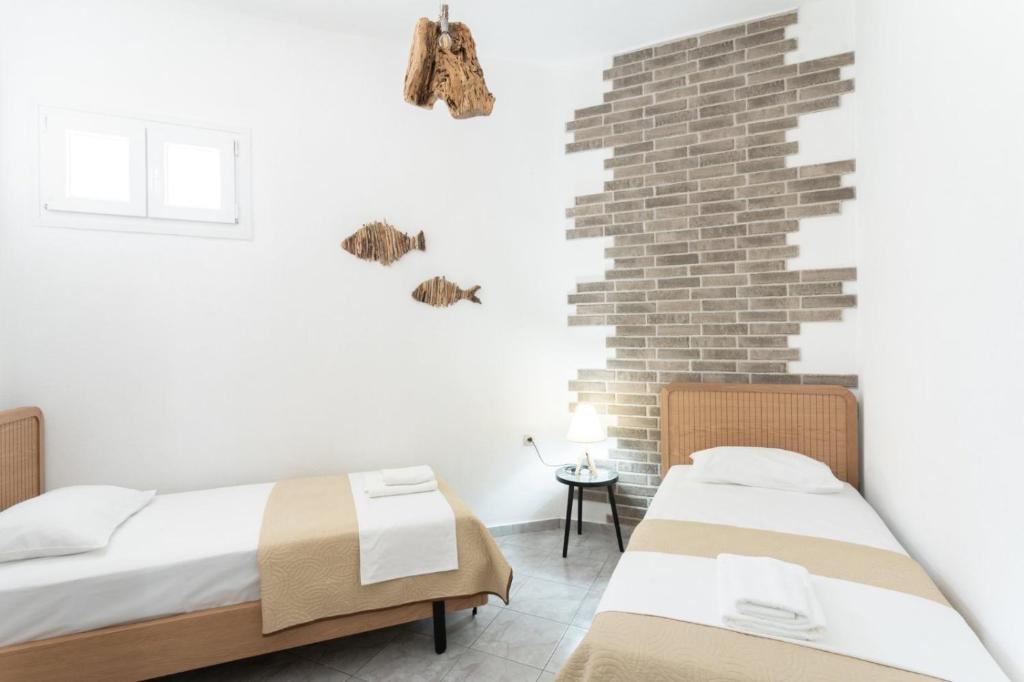 A bed or beds in a room at Eden apartments Paliouri- Concordia apartment