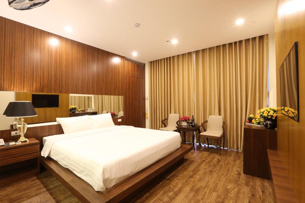 Postel nebo postele na pokoji v ubytování Au Viet Hotel