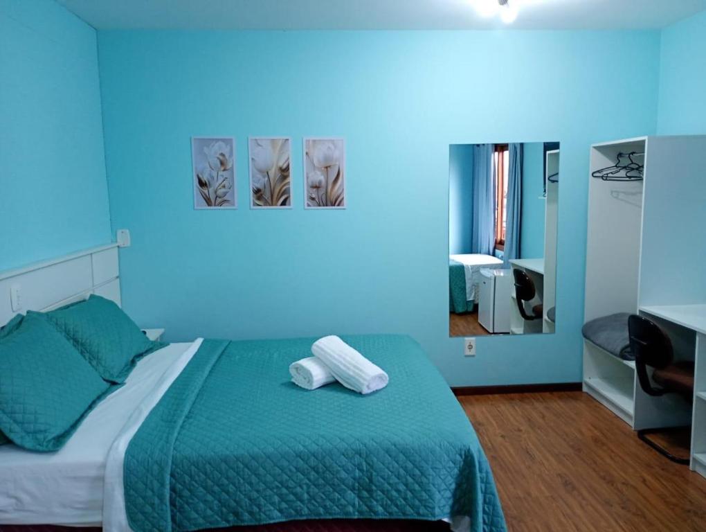 Postel nebo postele na pokoji v ubytování Residencial Amora