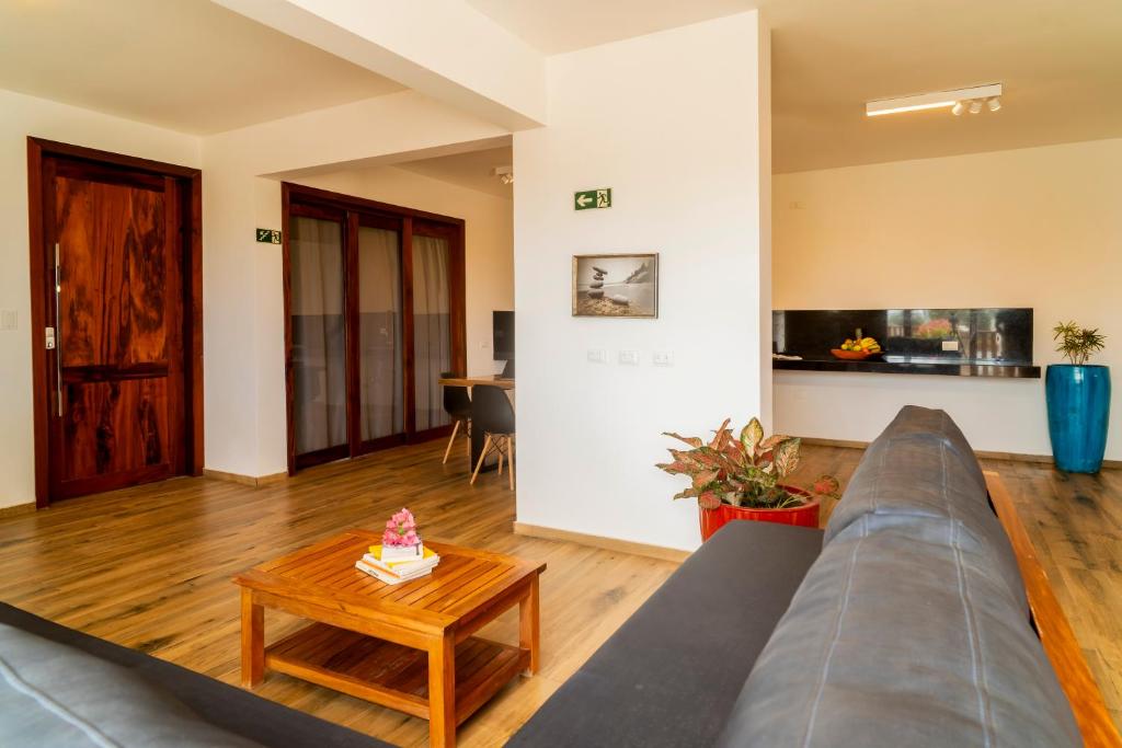 a living room with a couch and a table at Aiolos Hotel & Discoveries in Prea