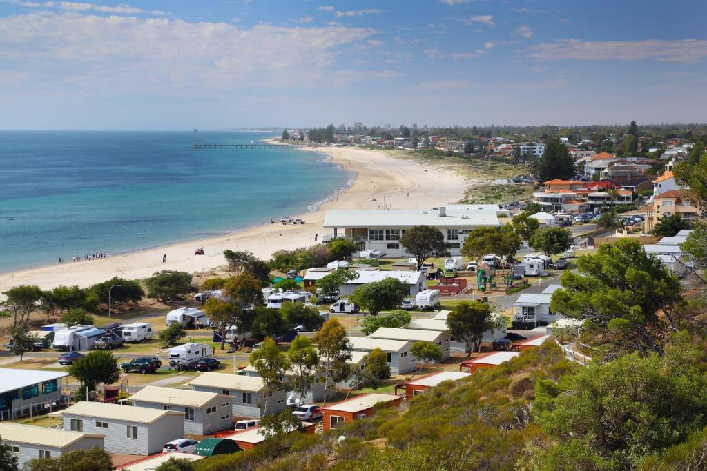an aerial view of a beach and a town at Brighton Beachfront Holiday Park Adelaide in Brighton
