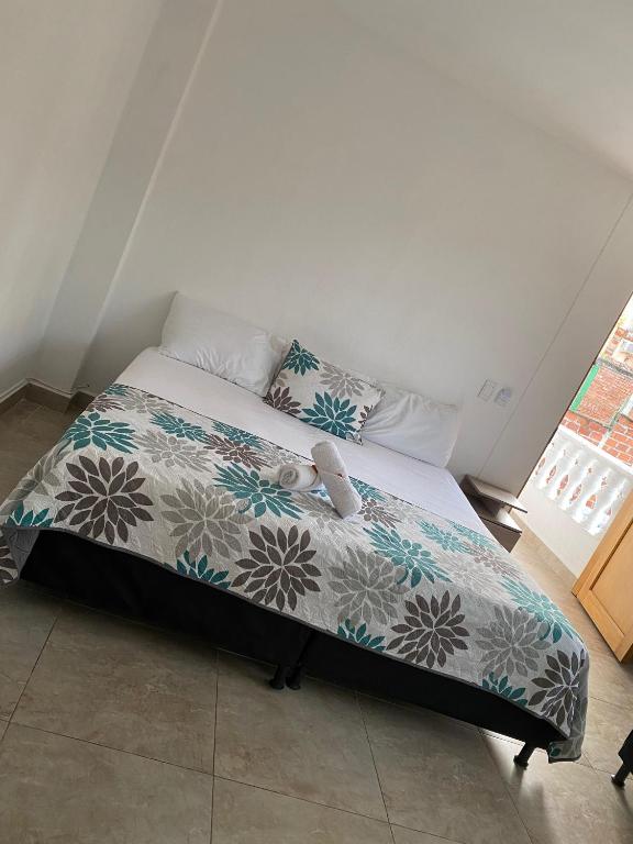 Rúm í herbergi á Hotel Santa Fe del Parque