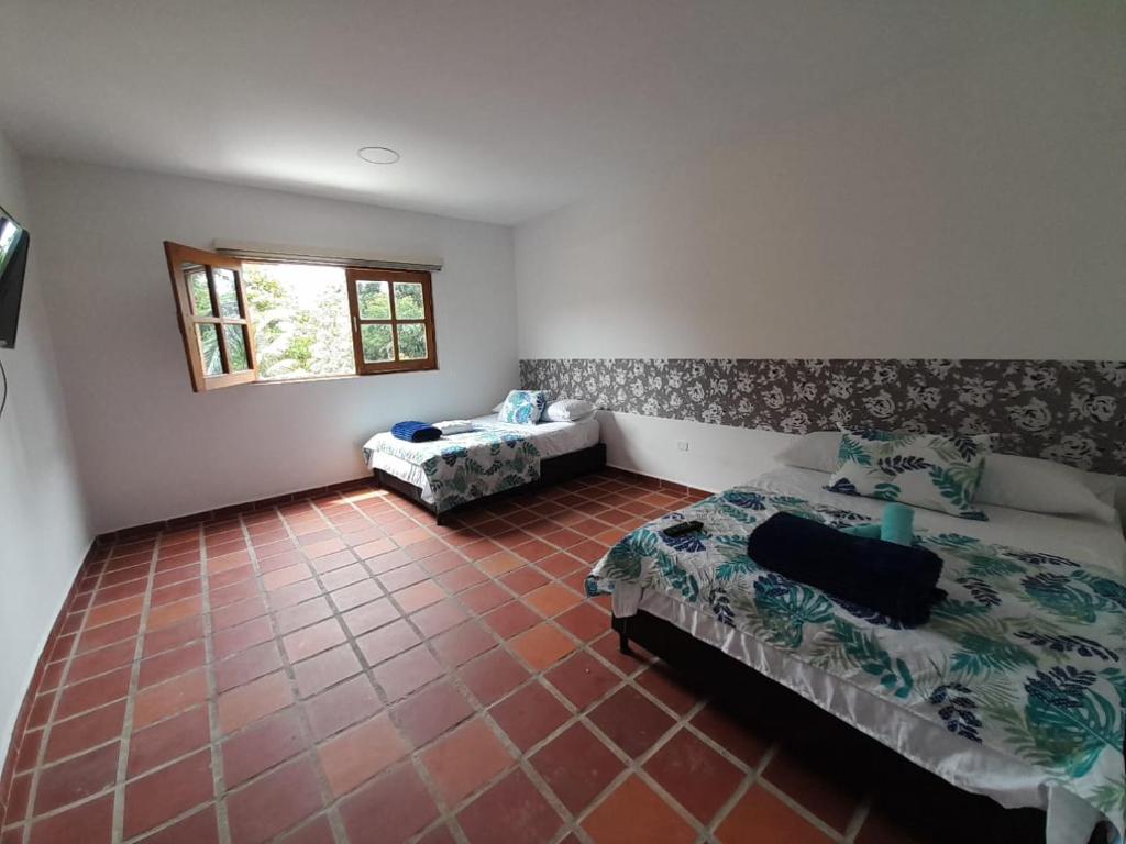 Rúm í herbergi á Hotel Santa Fe del Parque