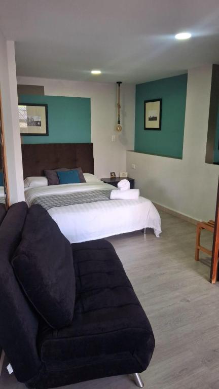 Un pat sau paturi într-o cameră la Apartahotel Millennials