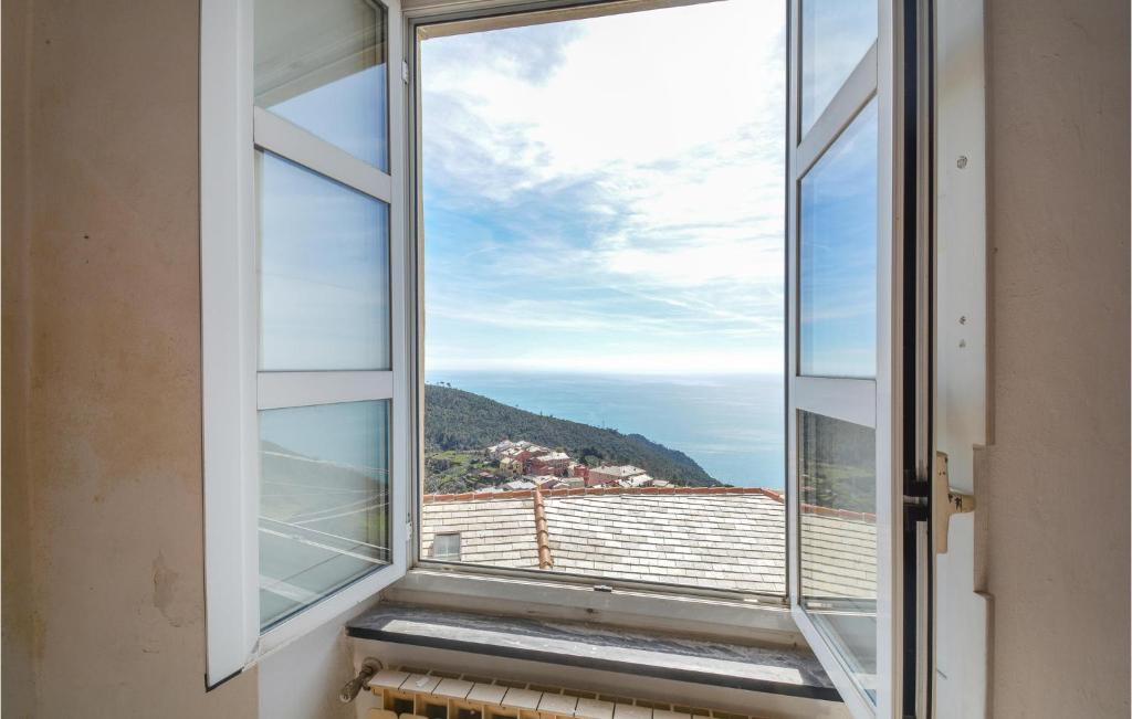 an open window with a view of the ocean at 2 Bedroom Gorgeous Home In Bonassola in Bonassola
