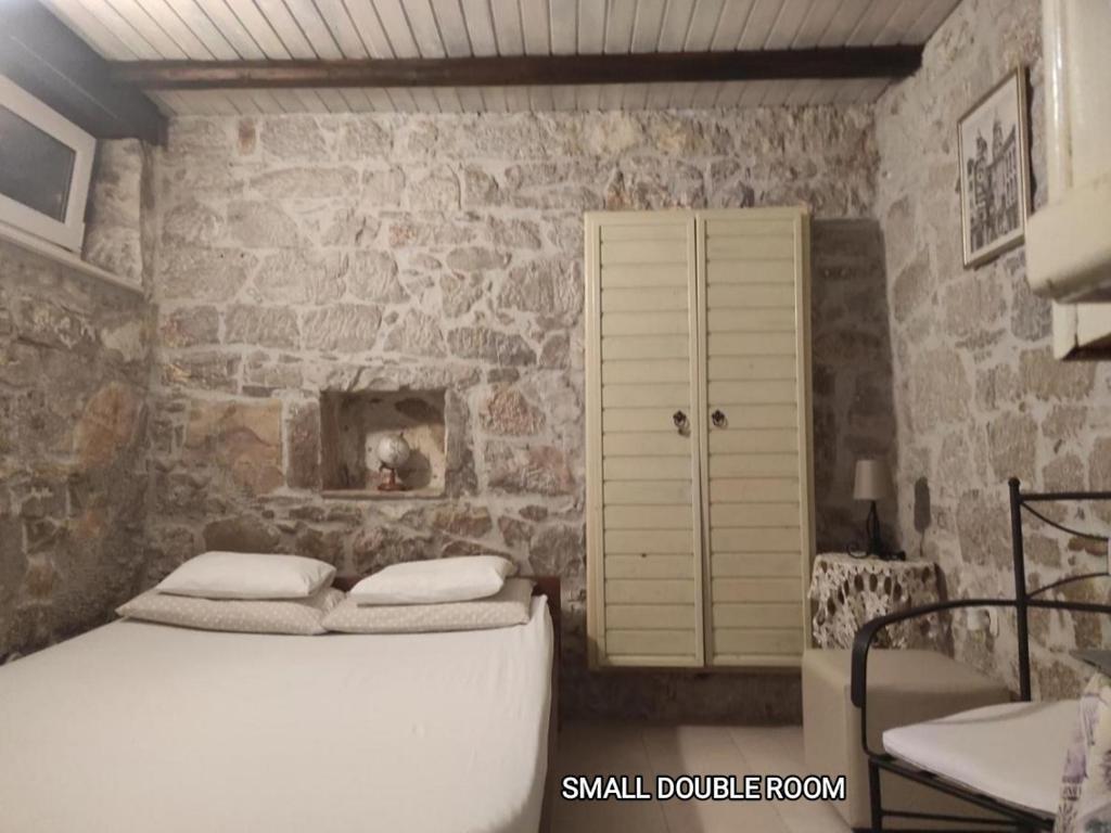 Postel nebo postele na pokoji v ubytování Guesthouse Mirula