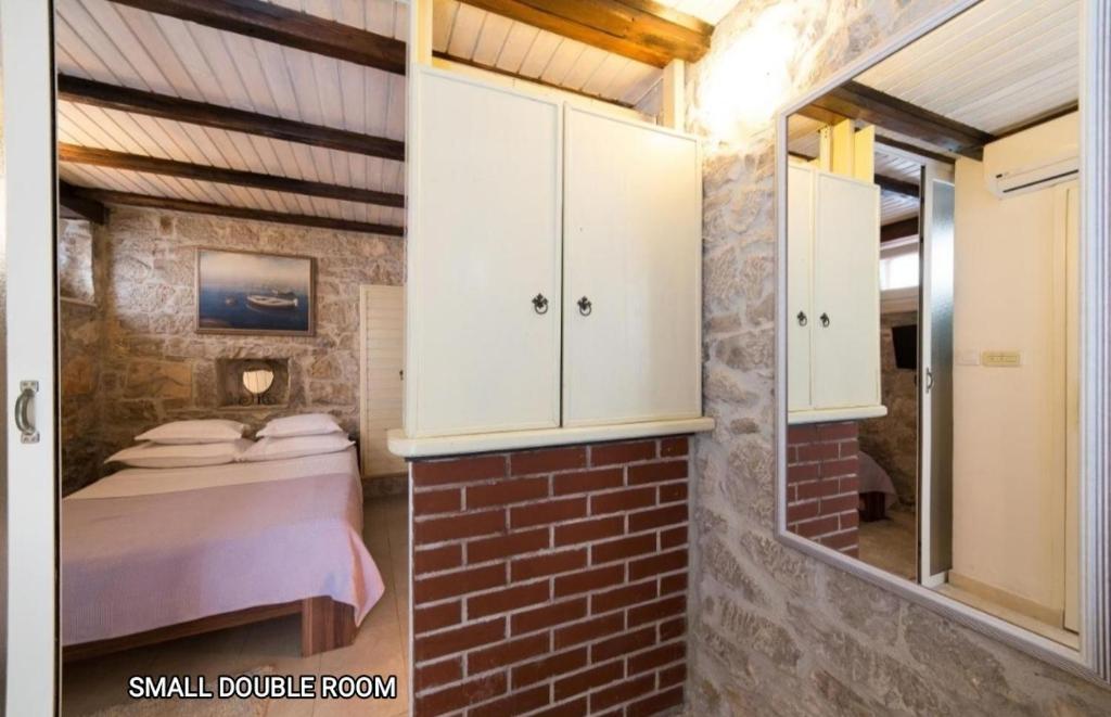 Postel nebo postele na pokoji v ubytování Guesthouse Mirula
