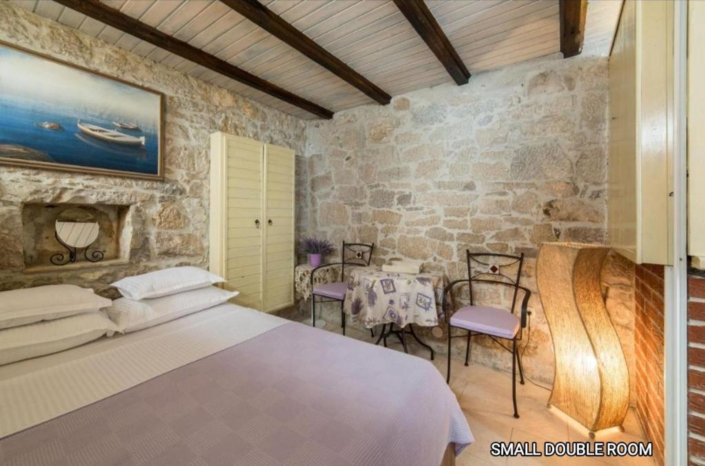 Postel nebo postele na pokoji v ubytování Guesthouse Mirula