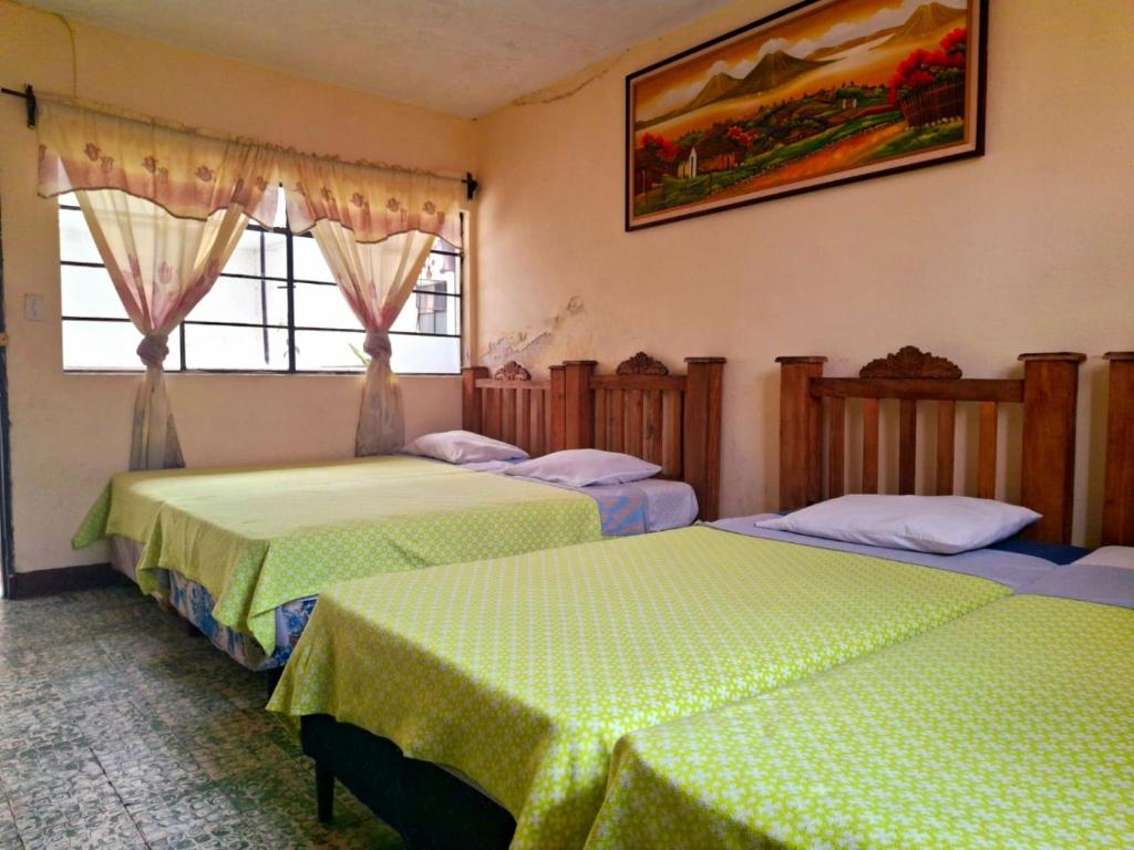 Ένα ή περισσότερα κρεβάτια σε δωμάτιο στο Hotel El Pasaje