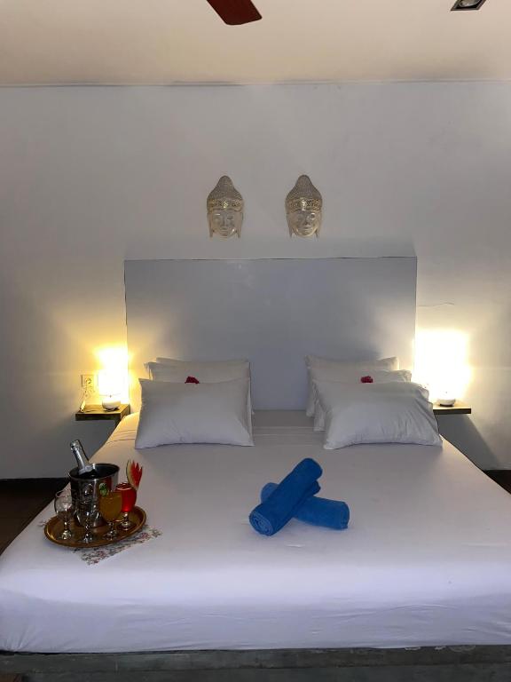 Postel nebo postele na pokoji v ubytování Gili Ocean Club - ADULTS ONLY