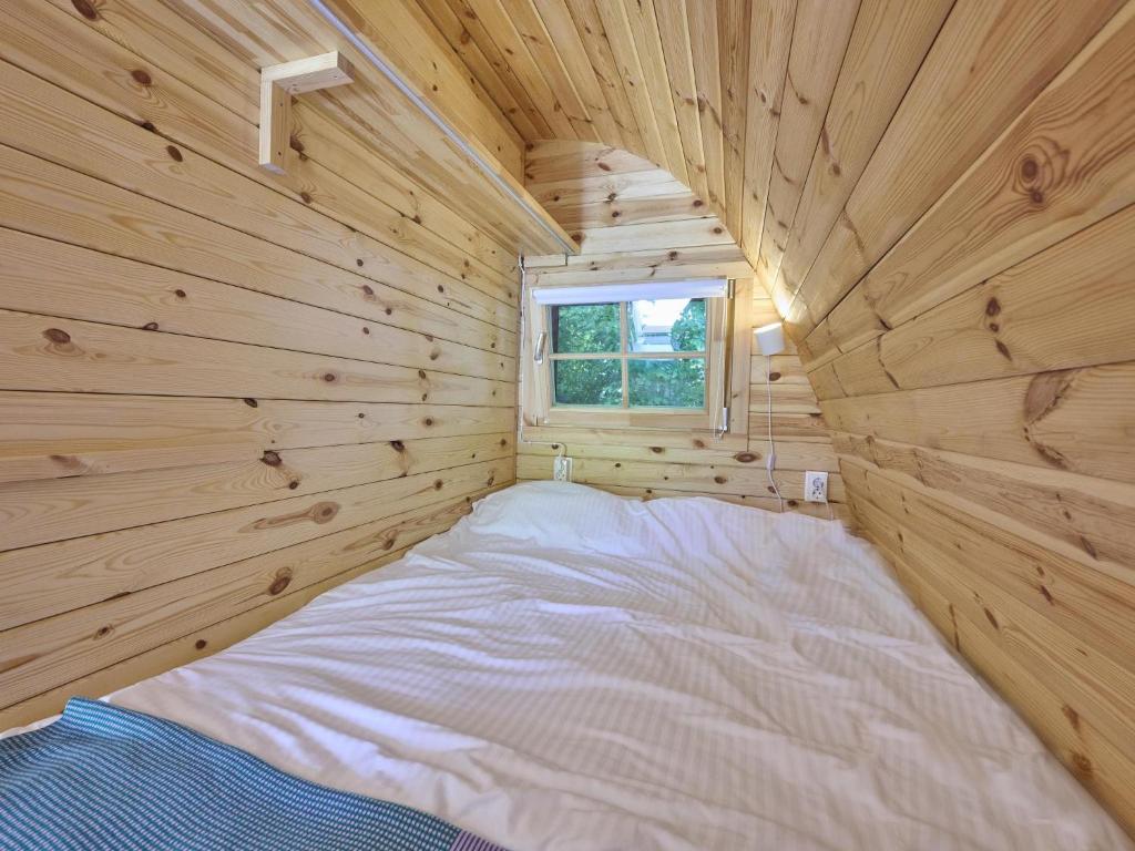 Una cama o camas en una habitación de Tiny House Jet