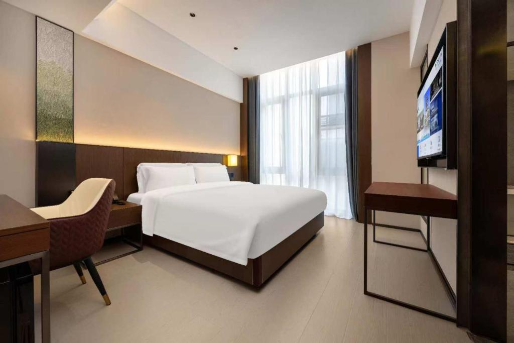 TV a/nebo společenská místnost v ubytování Beijing Suiyu Hotel