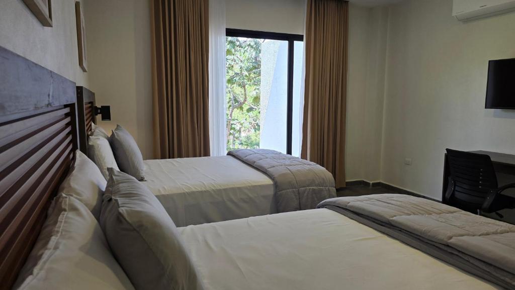 Ліжко або ліжка в номері Hotel Soliman