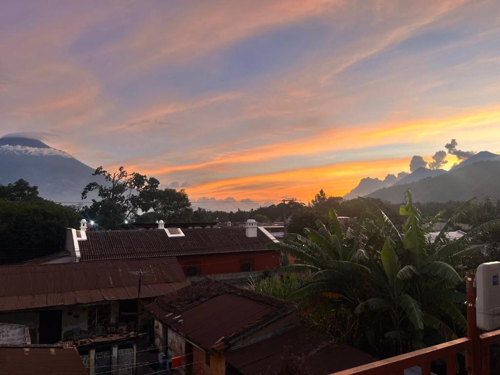 a sunset view from the roof of a house at Jireh guesthouse in Antigua Guatemala