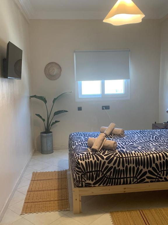 Ліжко або ліжка в номері Al Mohit Hôtel Dakhla