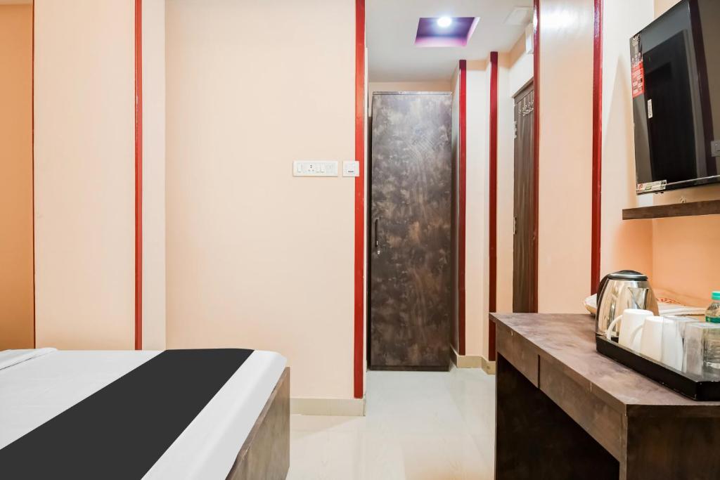 Postel nebo postele na pokoji v ubytování Super Hotel O MOHAR KUNJHA