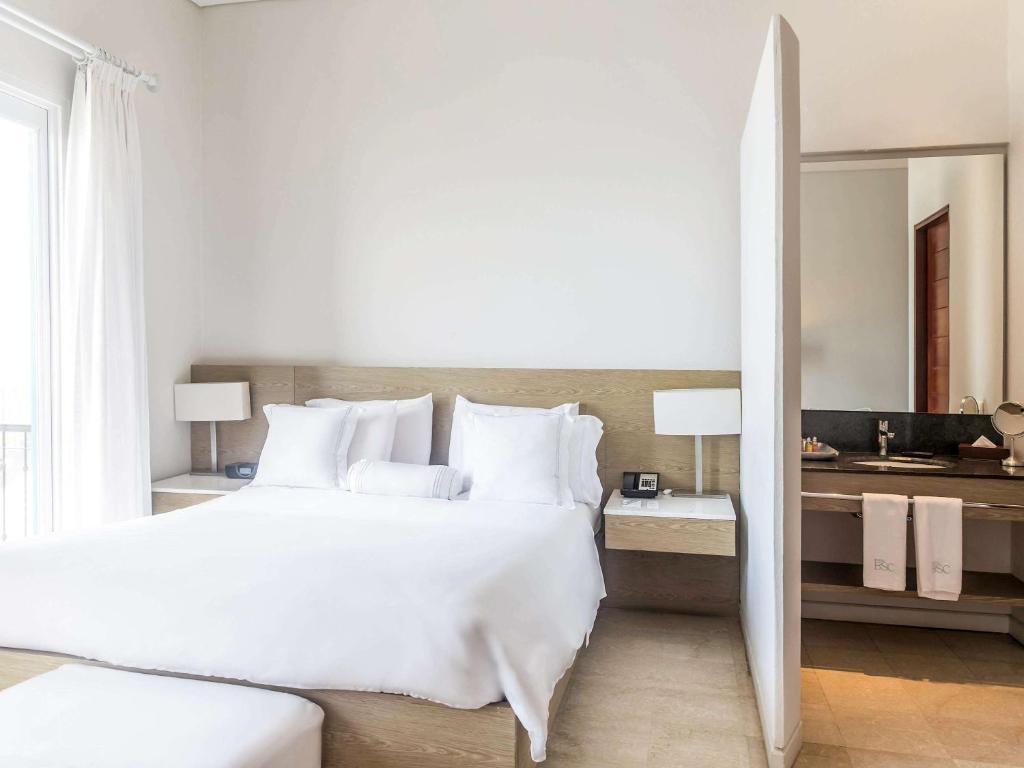 Postel nebo postele na pokoji v ubytování Hotel Boutique Bovedas de Santa Clara By Accor