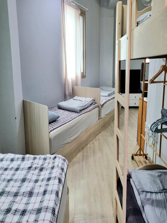 Postel nebo postele na pokoji v ubytování Wandonesia
