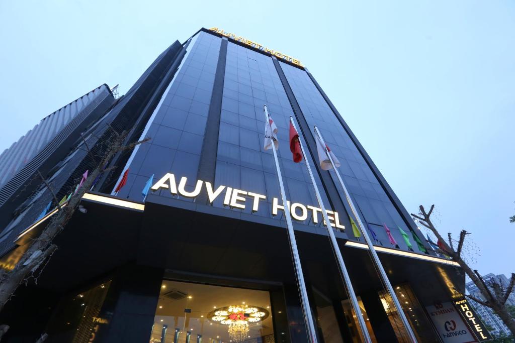 a building with a sign that reads await hotel at Au Viet Hotel in Hanoi