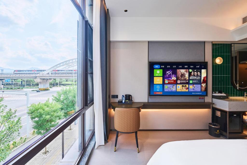 Postel nebo postele na pokoji v ubytování Beijing Suiyu Hotel