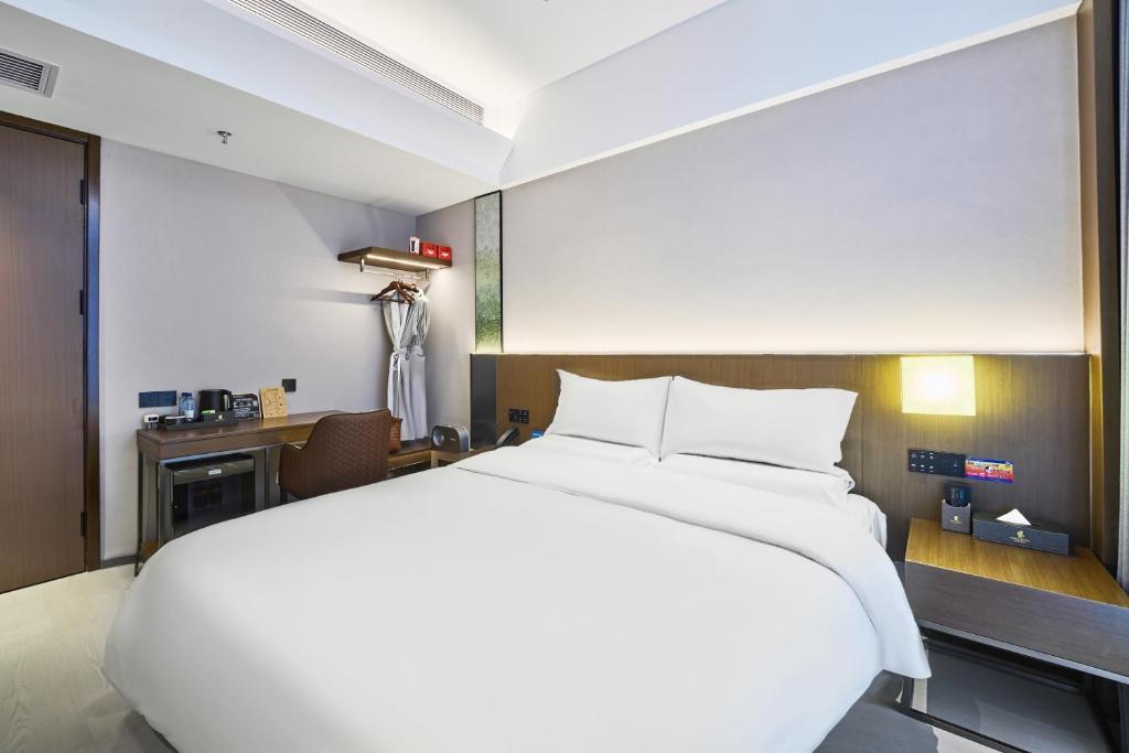 Postel nebo postele na pokoji v ubytování Beijing Suiyu Hotel