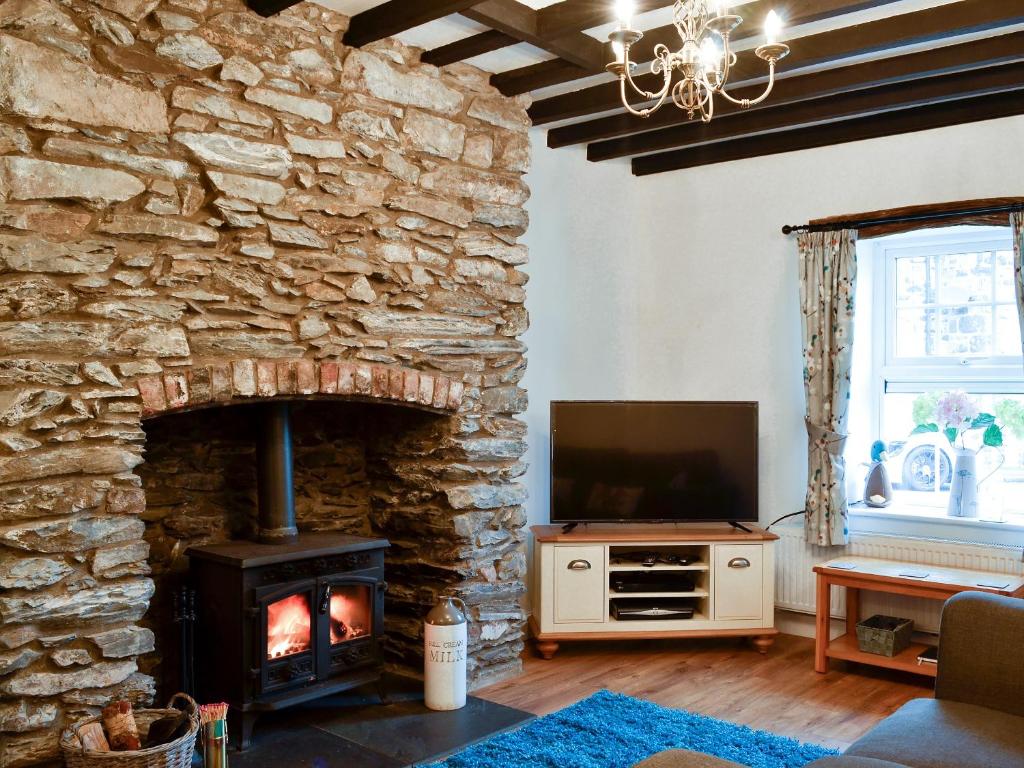 TV a/nebo společenská místnost v ubytování Noddfa Cottage