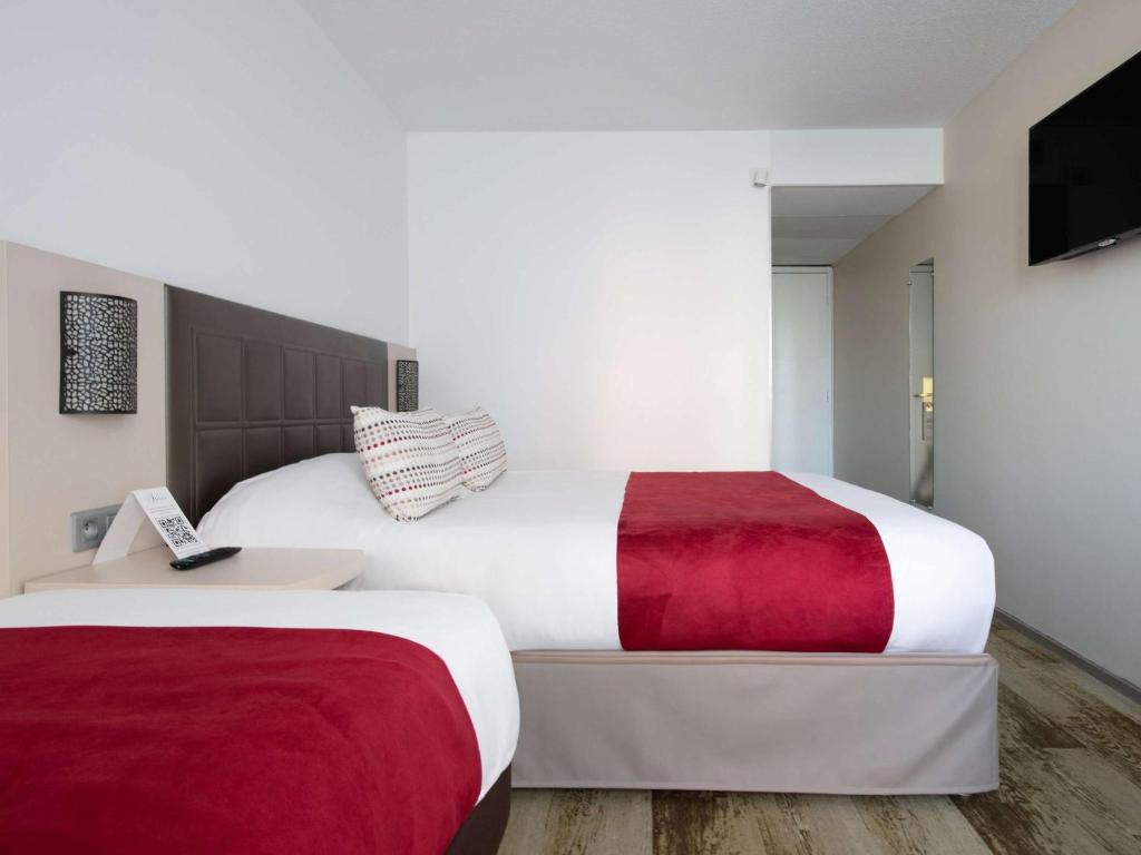 Postel nebo postele na pokoji v ubytování Hotel Atrium Arles Centre