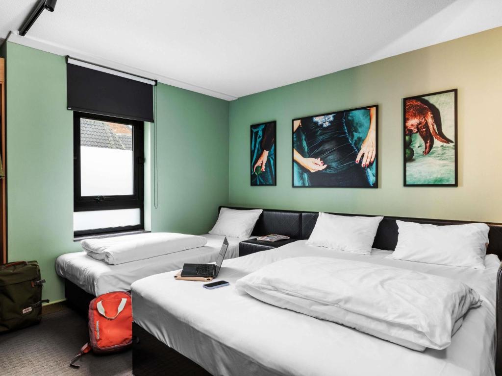 Postel nebo postele na pokoji v ubytování ibis Styles Hasselt City Centre