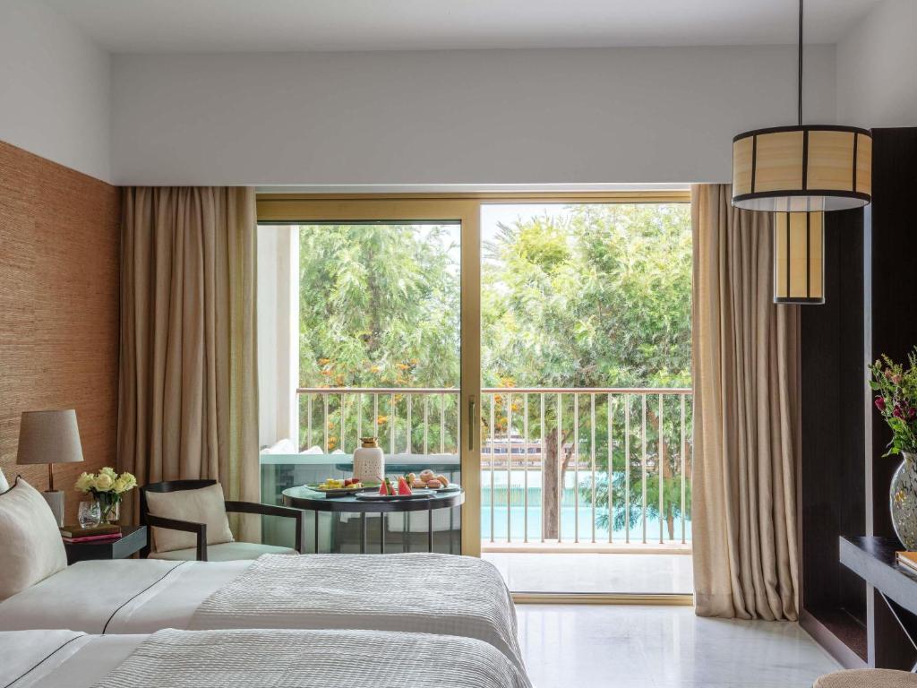 Кровать или кровати в номере Victoria Golf Resort and Spa Managed by Accor