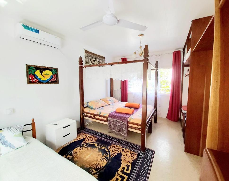 Postel nebo postele na pokoji v ubytování Ocean Breeze Guest House