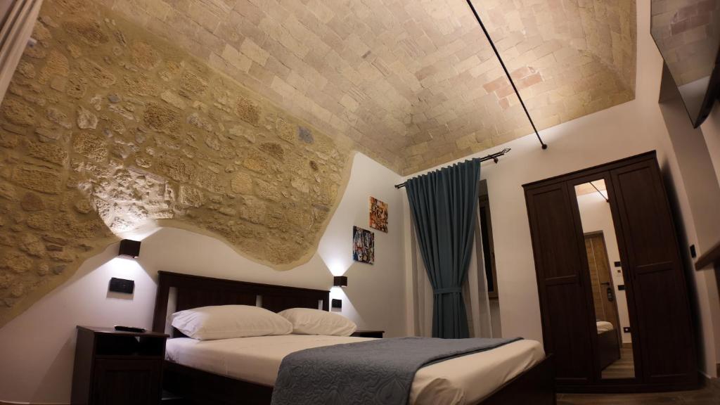 Ένα ή περισσότερα κρεβάτια σε δωμάτιο στο B&B Le Volte
