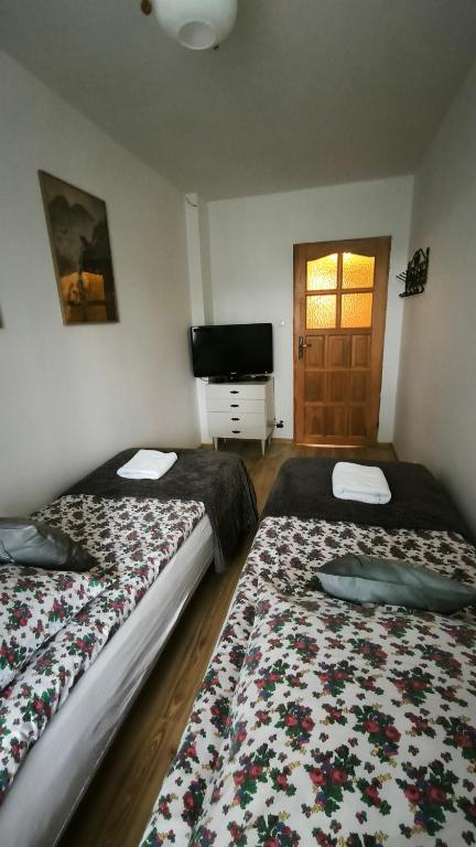 Posteľ alebo postele v izbe v ubytovaní Retrospekcja - Apartament w centrum