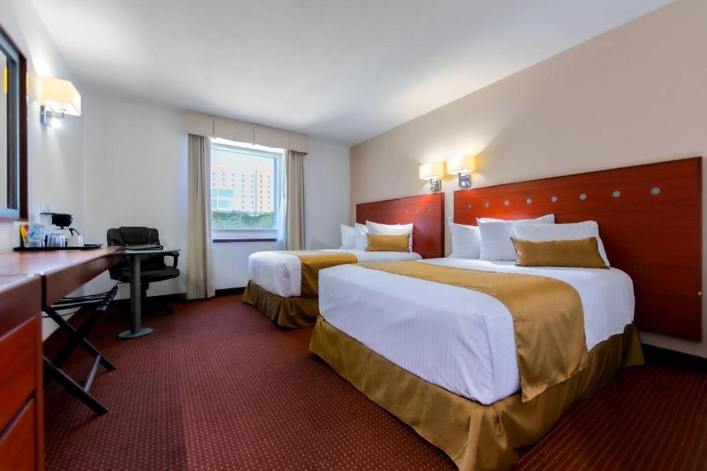 Postel nebo postele na pokoji v ubytování Comfort Inn Queretaro Tecnologico