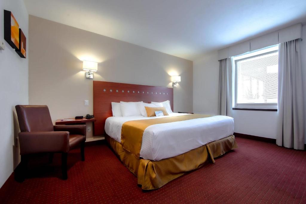Postel nebo postele na pokoji v ubytování Comfort Inn Queretaro Tecnologico