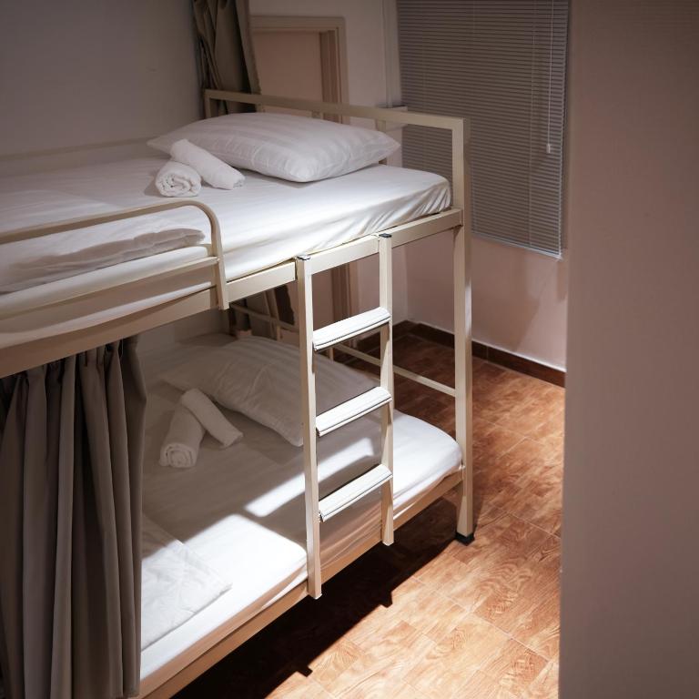 Voodi või voodid majutusasutuse BenHouse the Dorm toas