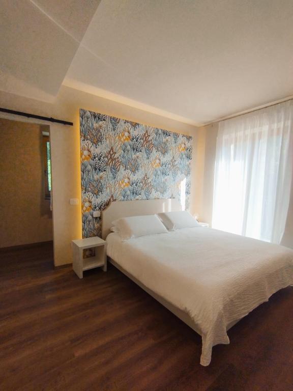 Postel nebo postele na pokoji v ubytování Locanda Vecchio Mulino