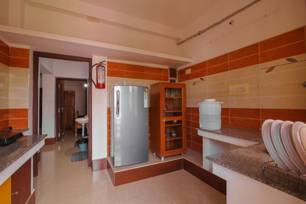 Kuchyň nebo kuchyňský kout v ubytování Manora Residency