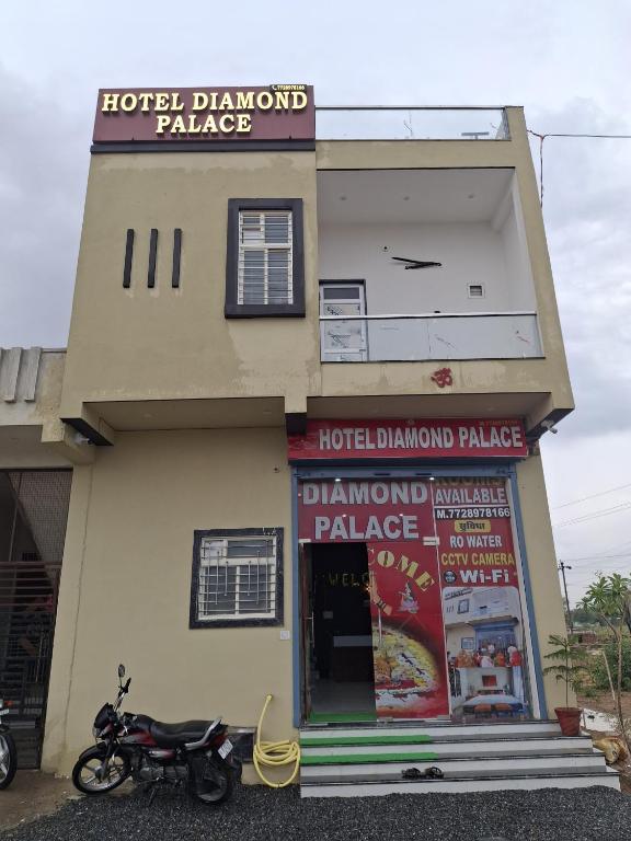 a motorcycle parked in front of a hotel diamond pancakes at Hotel Diamond Place in Khātu