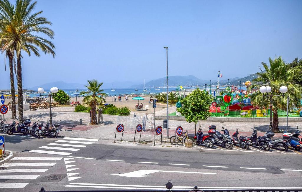a group of motorcycles parked on a street near a beach at Nice Apartment In Sestri Levante in Sestri Levante
