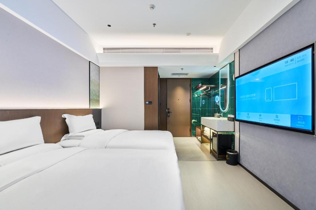 TV a/nebo společenská místnost v ubytování Beijing Suiyu Hotel