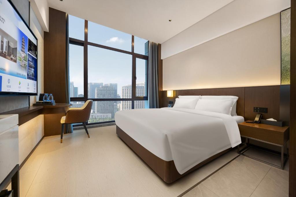 TV a/nebo společenská místnost v ubytování Beijing Suiyu Hotel