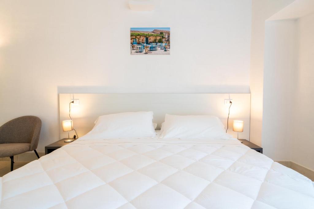 Postel nebo postele na pokoji v ubytování Borgo Vita Novella Resort