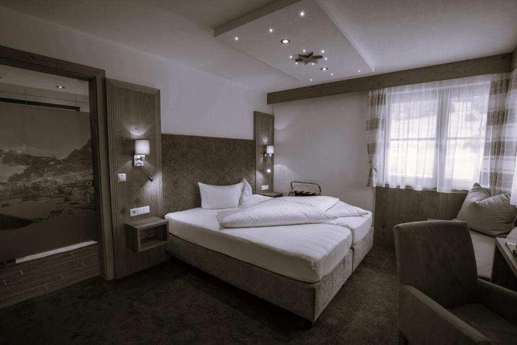 Postel nebo postele na pokoji v ubytování Hotel Persura