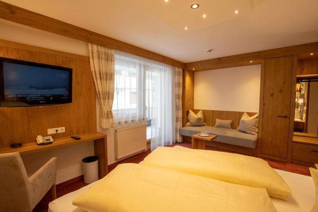 Postel nebo postele na pokoji v ubytování Hotel Persura