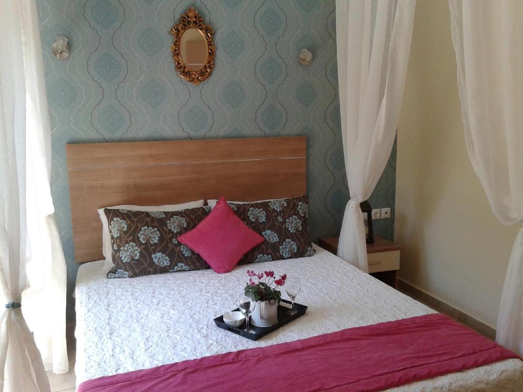 Postel nebo postele na pokoji v ubytování Kaplanis House