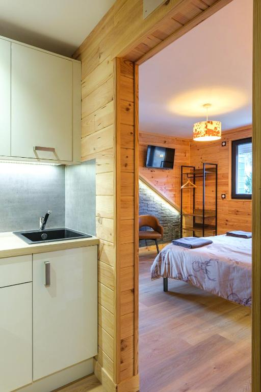 Letto o letti in una camera di Apart Hôtel des Cols