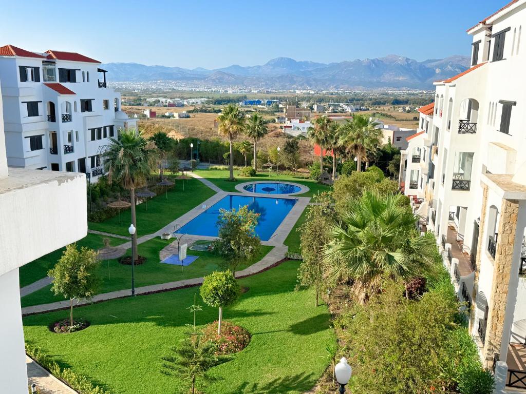 Bazén v ubytování Appartement climatisé vue piscine - Lilacs garden CaboNegro nebo v jeho okolí